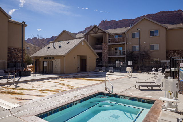 2511 Redcliff Road, Unit 3A Moab, UT 84532 - Photo 24 of 24 Community pool with a mountain view, a patio, and a hot tub