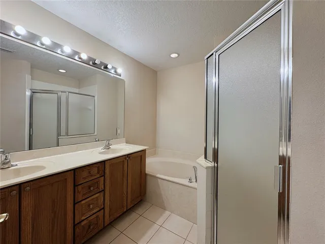 a spacious bathroom with a granite countertop sink mirror and double