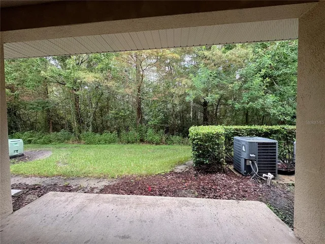 a backyard of a house with a yard and entertaining space