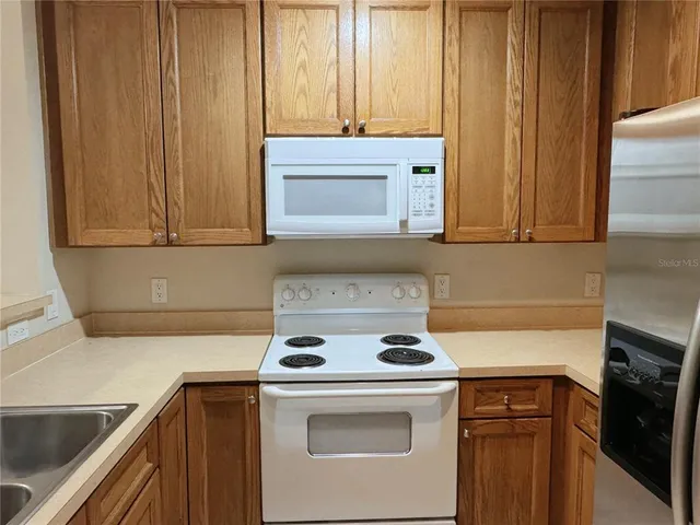 a kitchen with a stove and a microwave