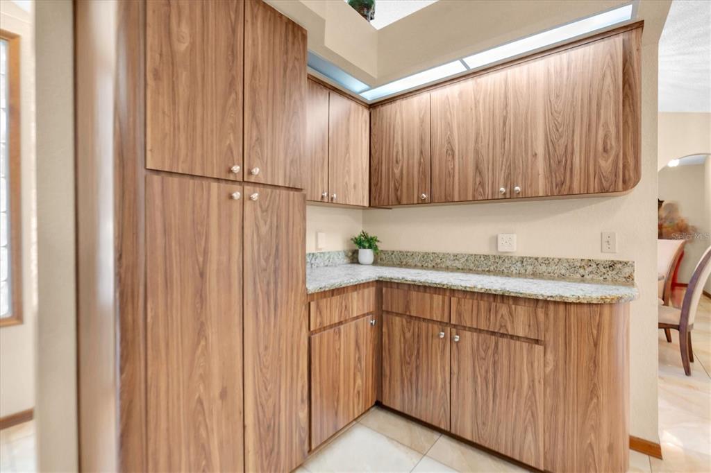 18809 Parade Road Hudson, FL 34667 - Photo 14 of 37 a kitchen with a sink and cabinets