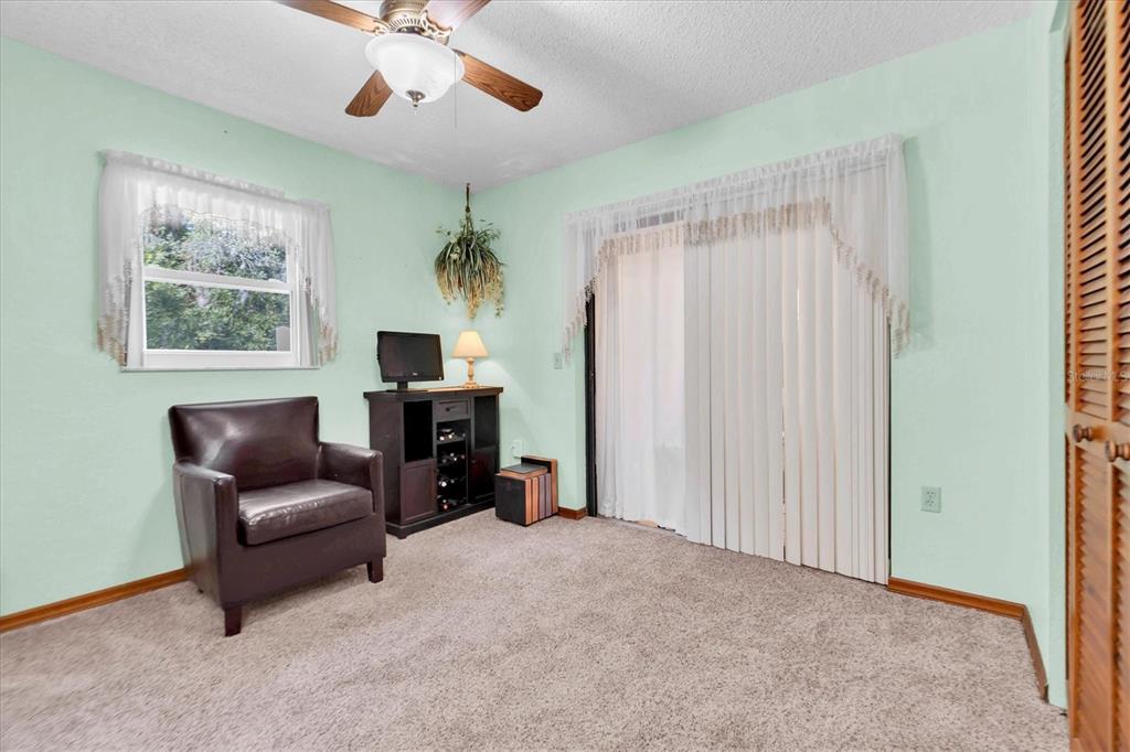 18809 Parade Road Hudson, FL 34667 - Photo 20 of 37 a living room with furniture and a fireplace