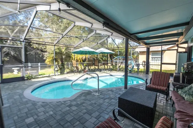 a view of a swimming pool with a patio