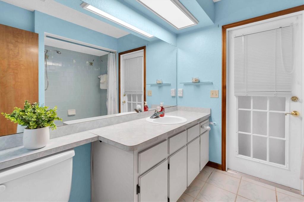 18809 Parade Road Hudson, FL 34667 - Photo 24 of 37 a bathroom with a sink and a mirror