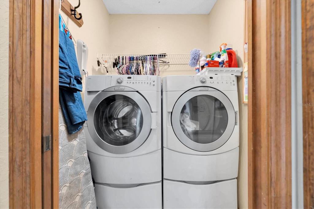 18809 Parade Road Hudson, FL 34667 - Photo 28 of 37 a utility room with dryer and washer