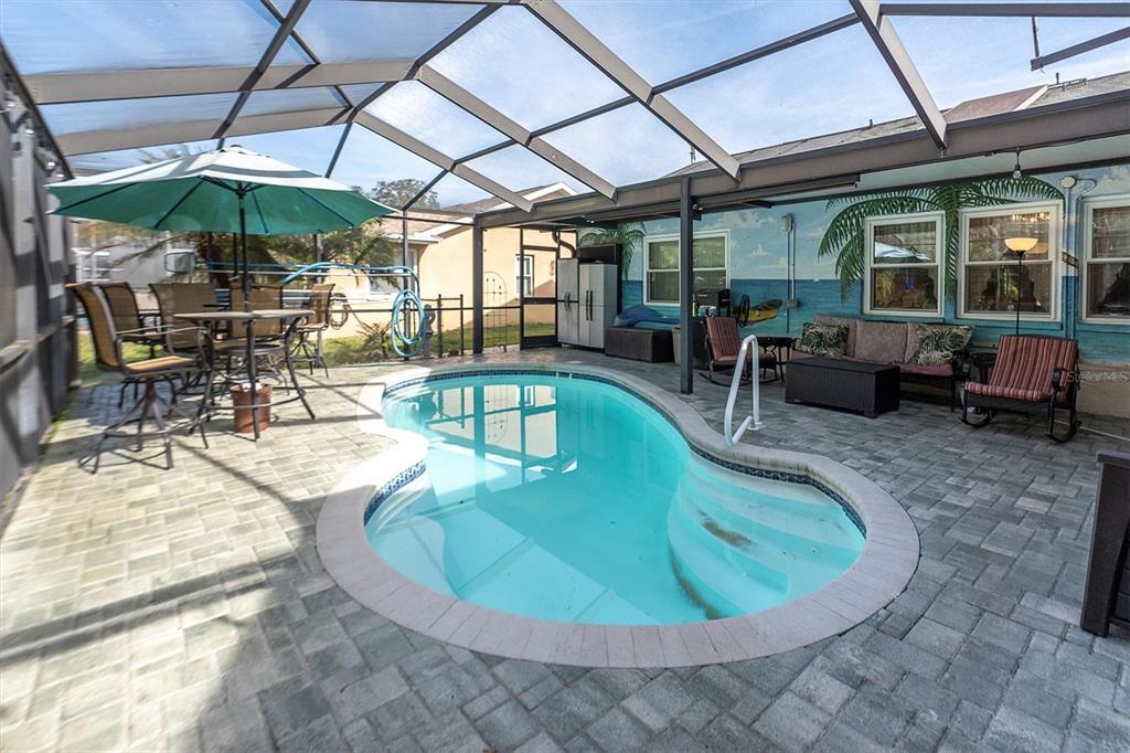 18809 Parade Road Hudson, FL 34667 - Photo 29 of 37 a view of a swimming pool with a patio