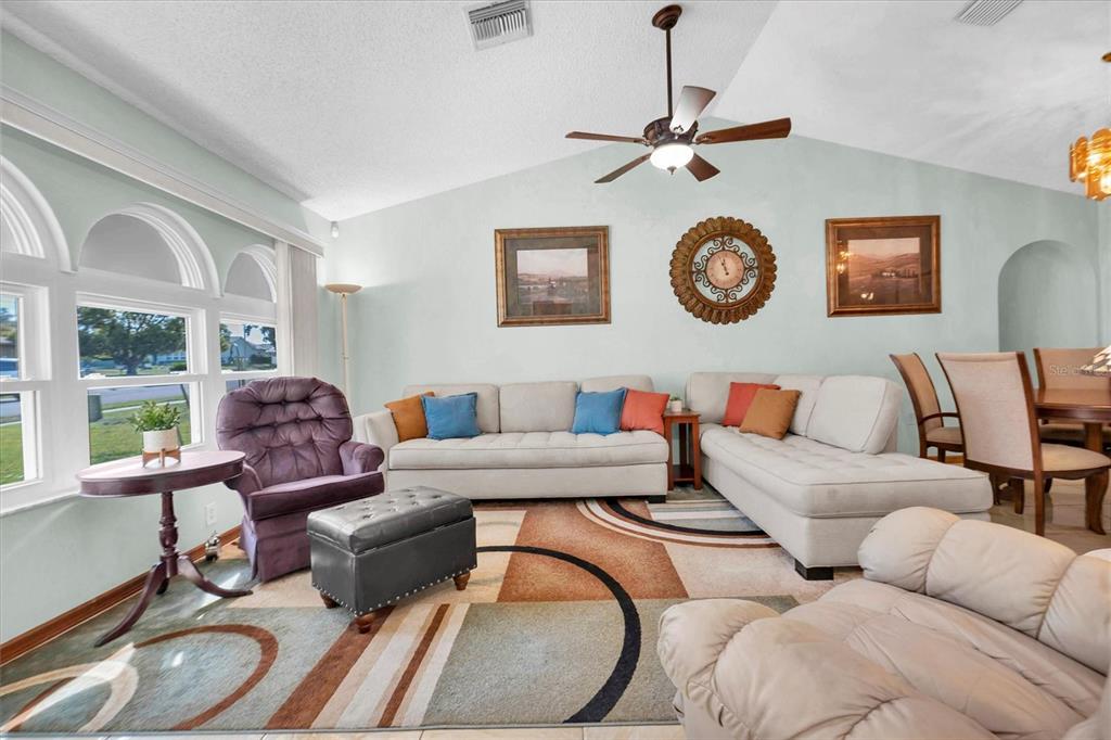 18809 Parade Road Hudson, FL 34667 - Photo 6 of 37 a living room with furniture and a window