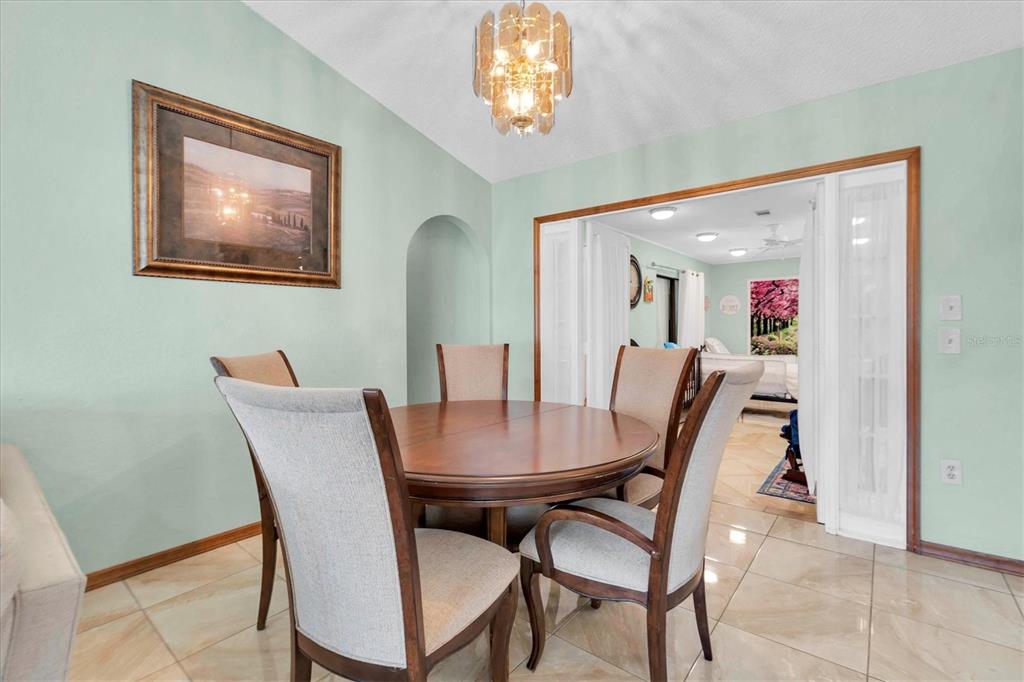 18809 Parade Road Hudson, FL 34667 - Photo 9 of 37 a view of a dining room with furniture