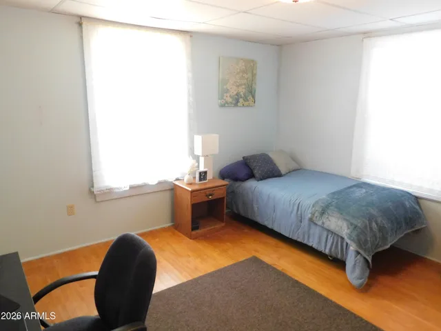 a bedroom with a bed and a window