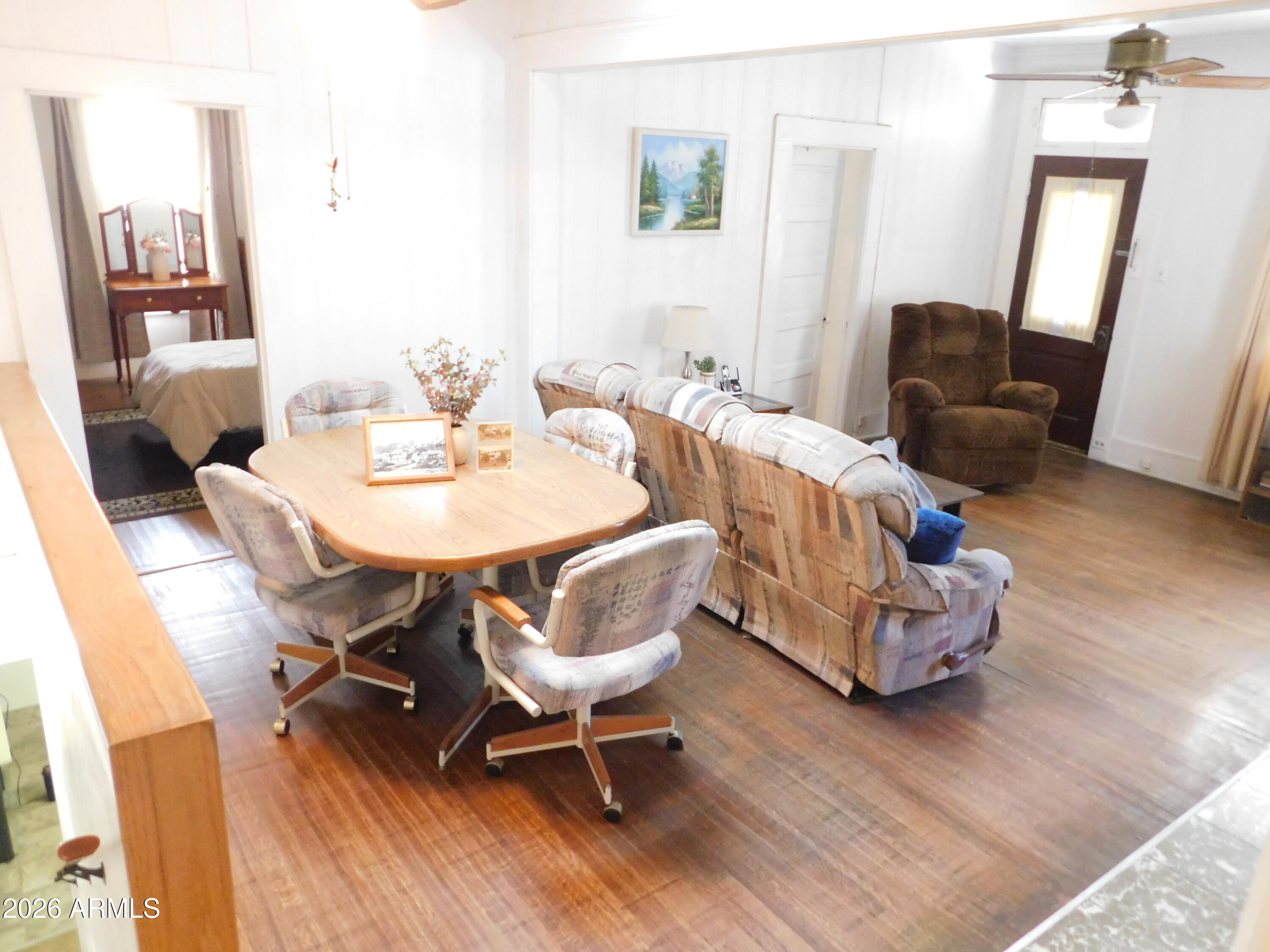 414 Tombstone Canyon Bisbee, AZ 85603 - Photo 16 of 44 a dining room with furniture and wooden floor