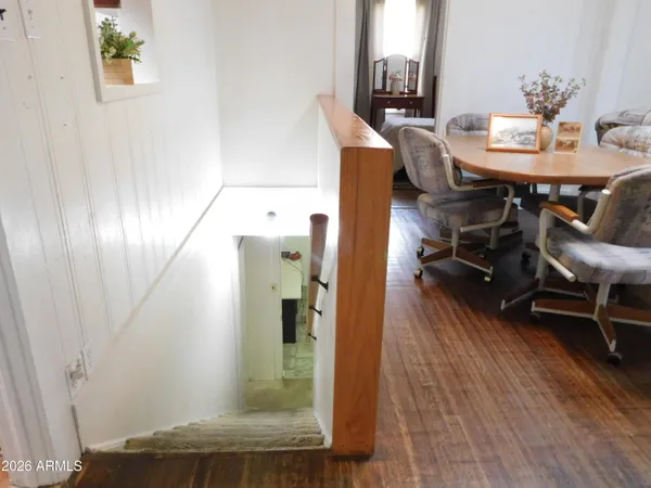 a view of a dining room with furniture and wooden floor