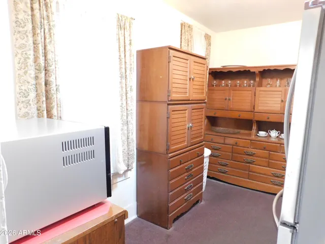 a view of walk in closet with clothes