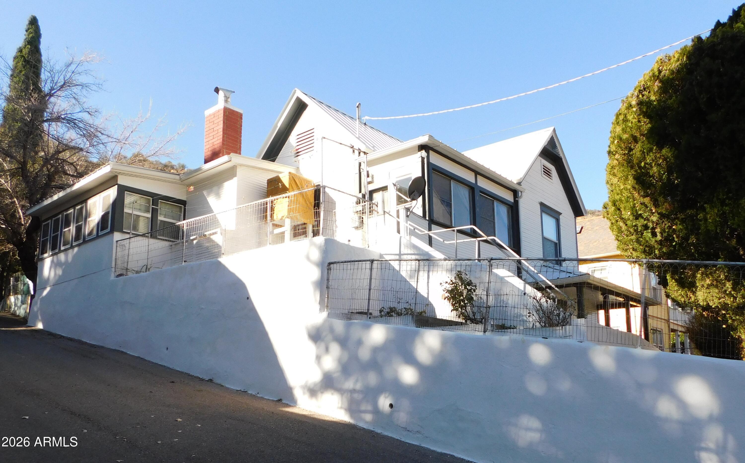 414 Tombstone Canyon Bisbee, AZ 85603 - Photo 2 of 44 a view of a street with houses