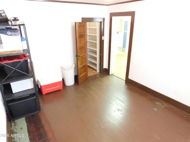 a view of empty room with rug and floor
