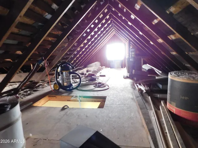 a lobby with furniture and floor to ceiling window