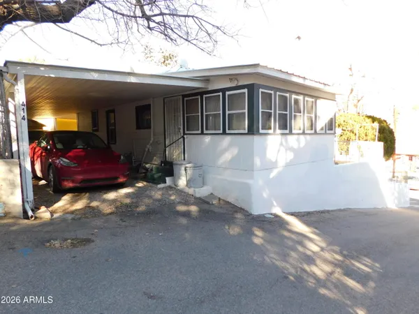 a room with a bed and a window