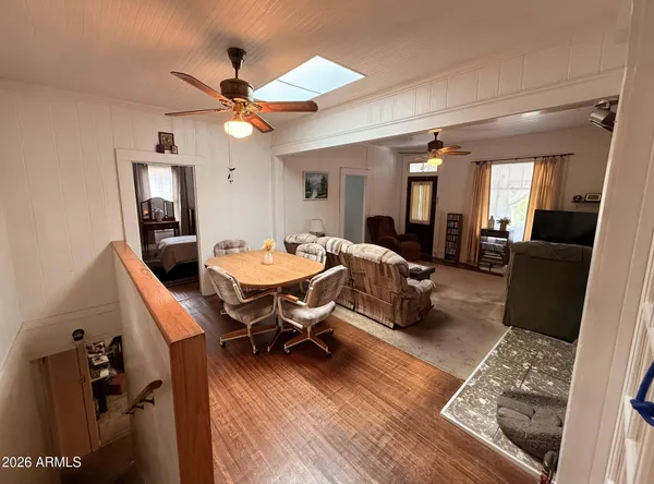 a living room with furniture a rug and a chandelier