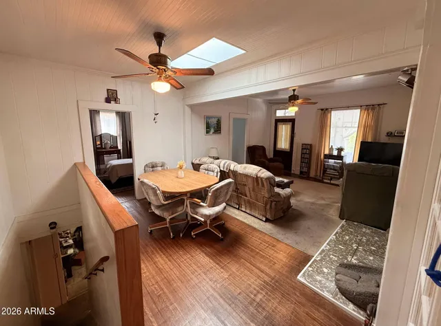 a living room with furniture a rug and a chandelier
