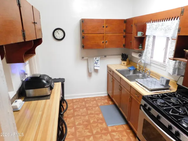 a kitchen with a stove and a refrigerator