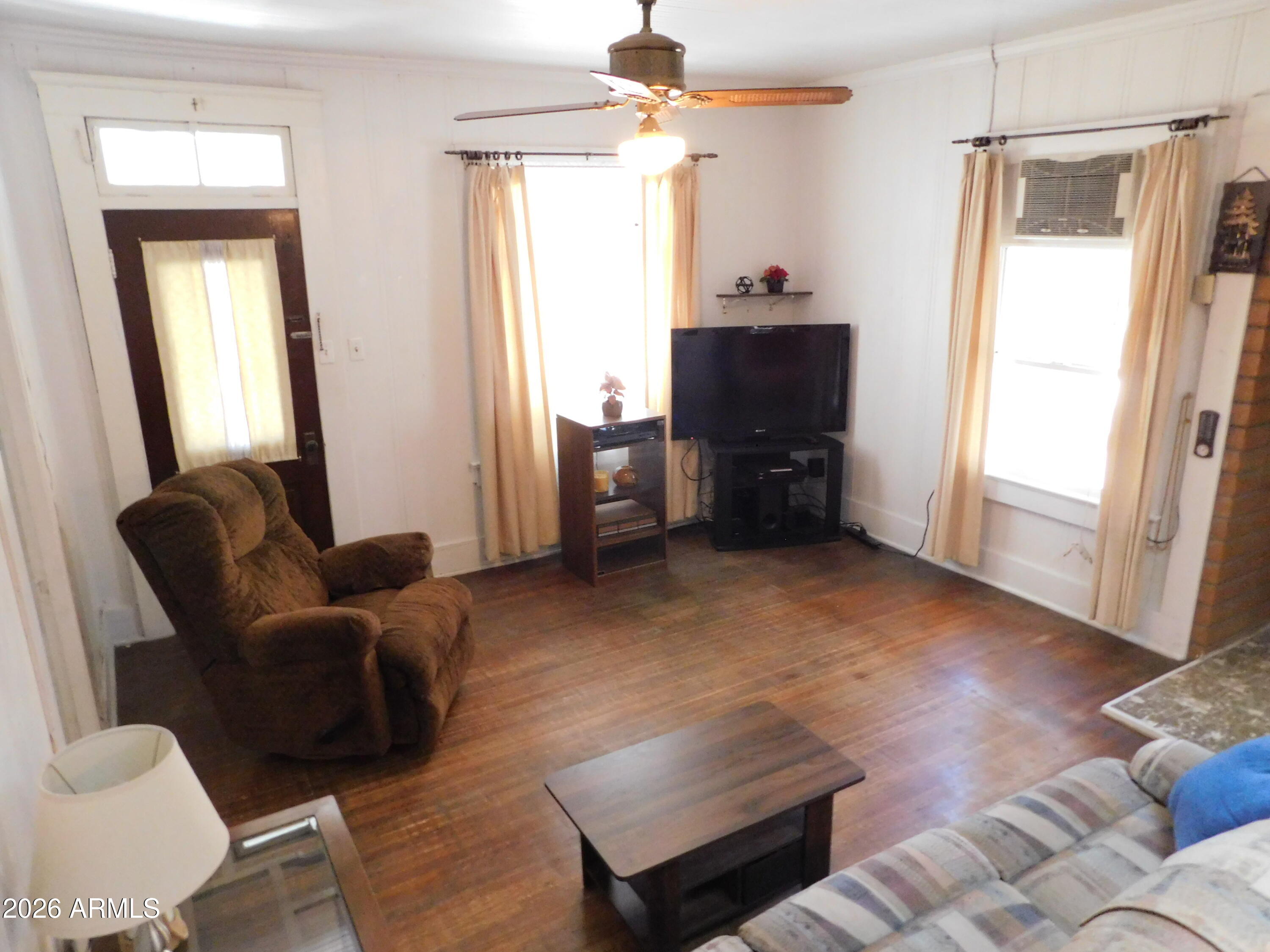 414 Tombstone Canyon Bisbee, AZ 85603 - Photo 7 of 44 a living room with furniture and a window
