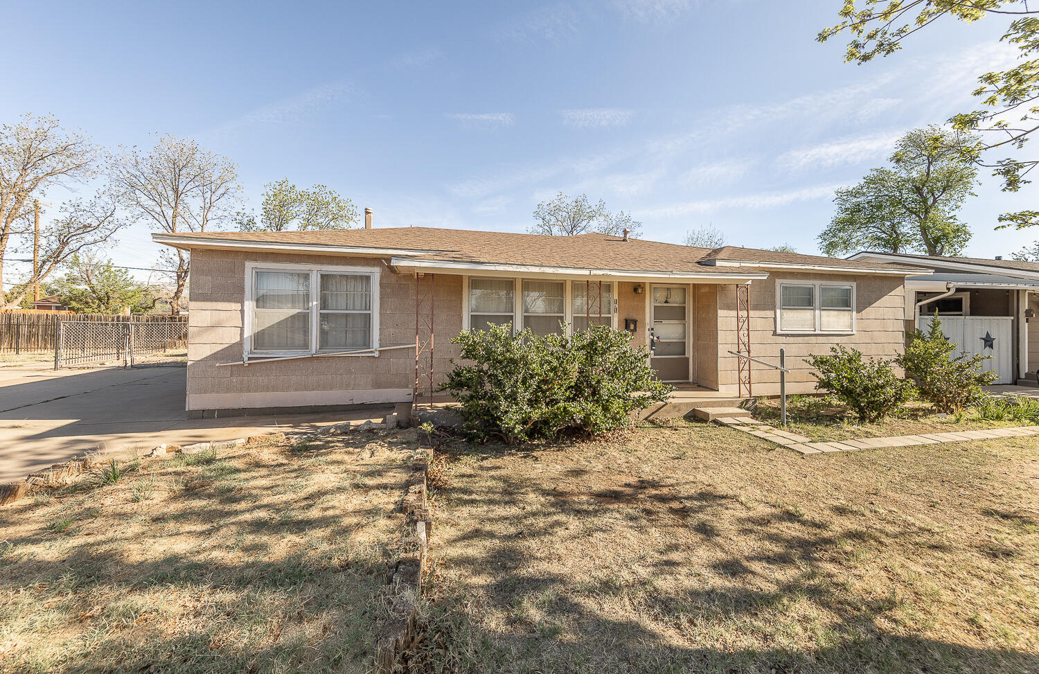 1918 42nd Street Lubbock, TX 79412 - Photo 14 of 29 front view of house with a yard