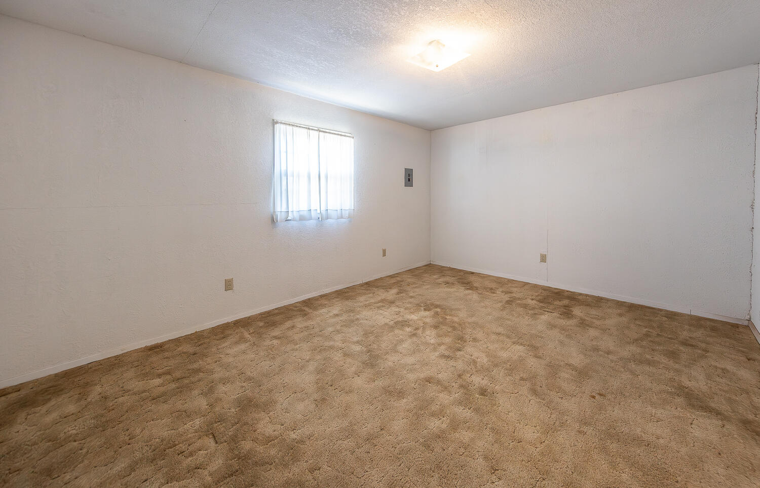 1918 42nd Street Lubbock, TX 79412 - Photo 18 of 29 an empty room with a window