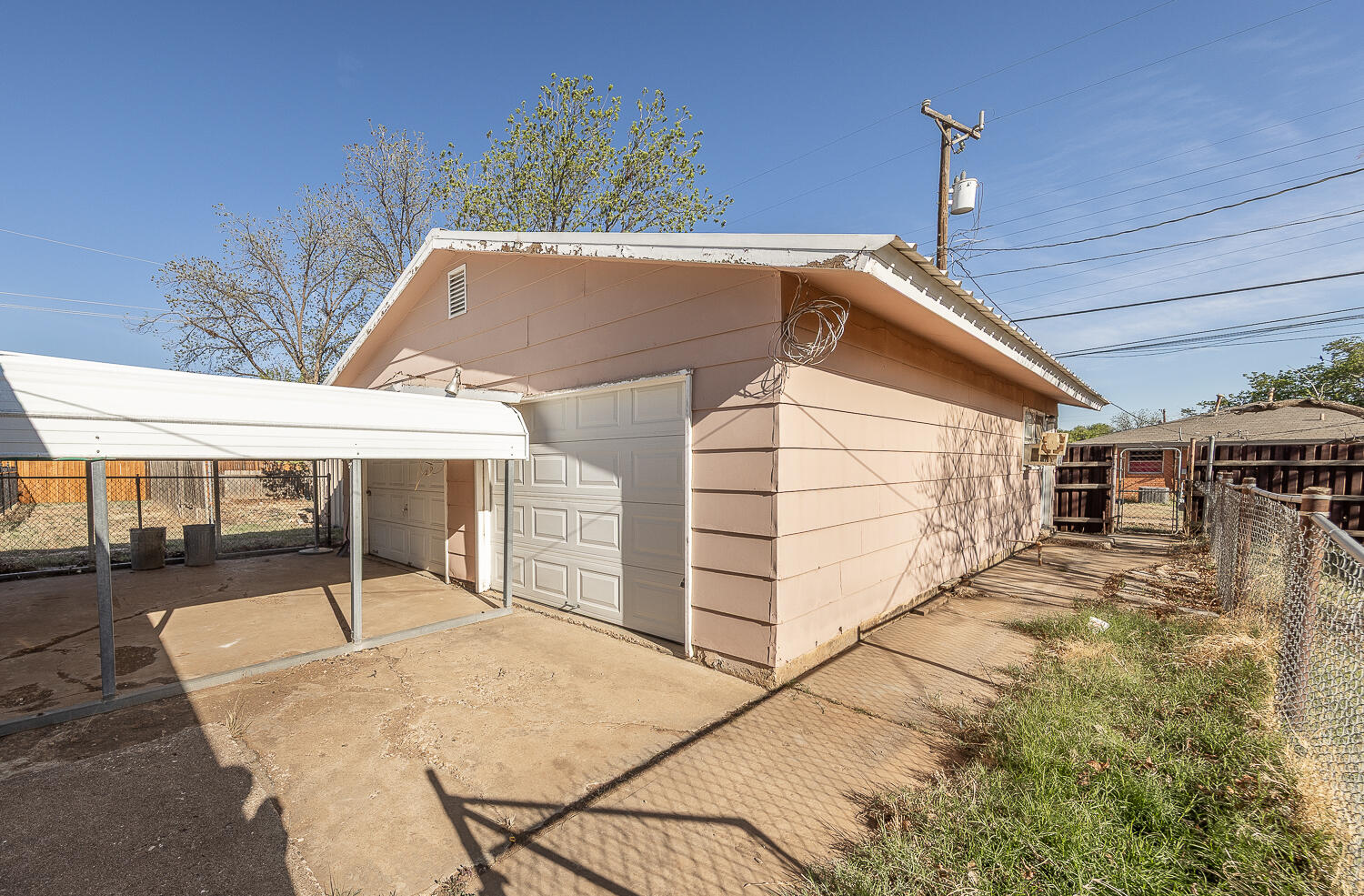 1918 42nd Street Lubbock, TX 79412 - Photo 22 of 29 a patio with table and chairs and potted plants