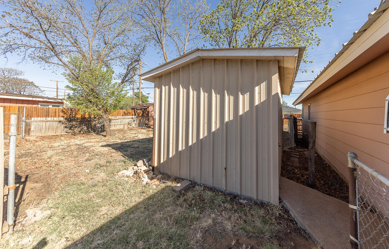 1918 42nd Street Lubbock, TX 79412 - Photo 27 of 29 a view of a small yard with wooden fence
