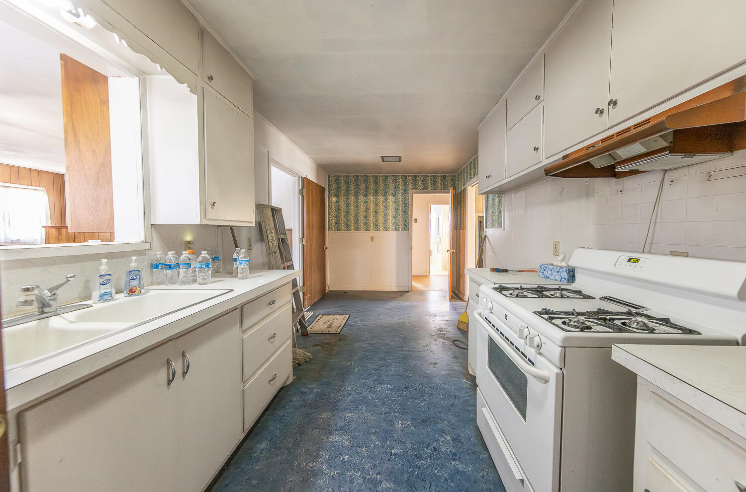 1918 42nd Street Lubbock, TX 79412 - Photo 9 of 29 a kitchen that has a sink and a stove