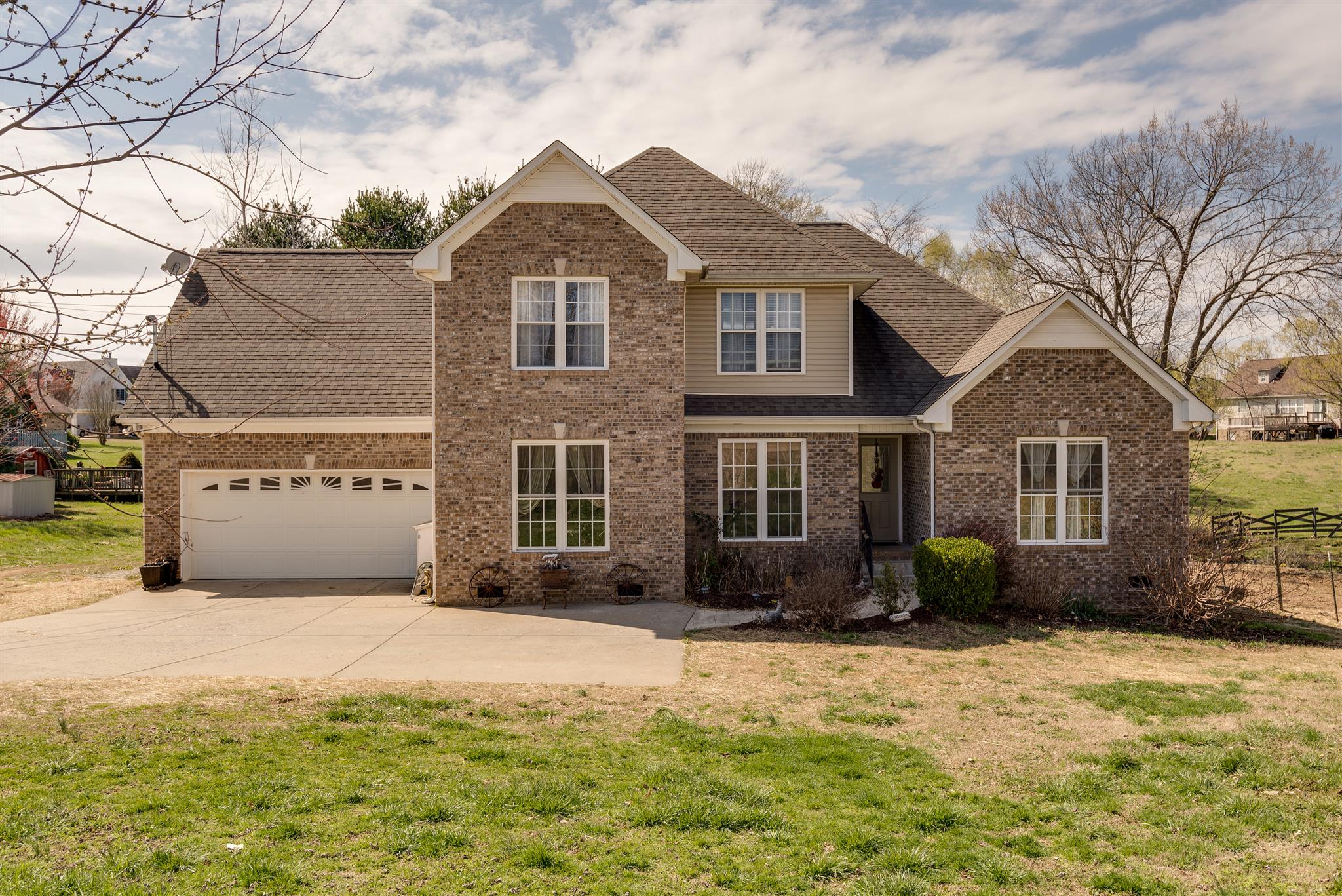 2225 Clara Mathis Road Spring Hill, TN 37174 - Photo 1 of 19 a front view of a house with a yard