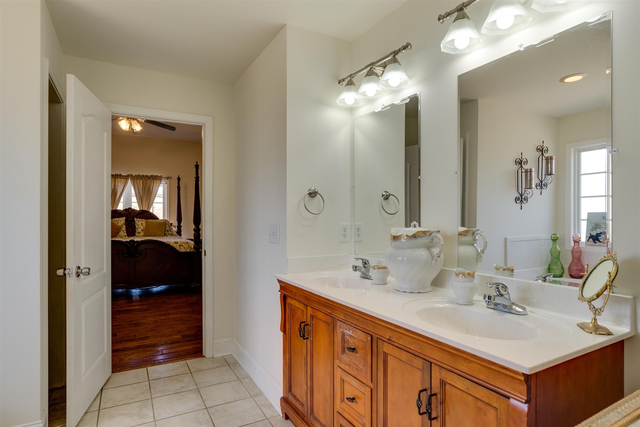 2225 Clara Mathis Road Spring Hill, TN 37174 - Photo 11 of 19 a bathroom with a sink double vanity and a mirror