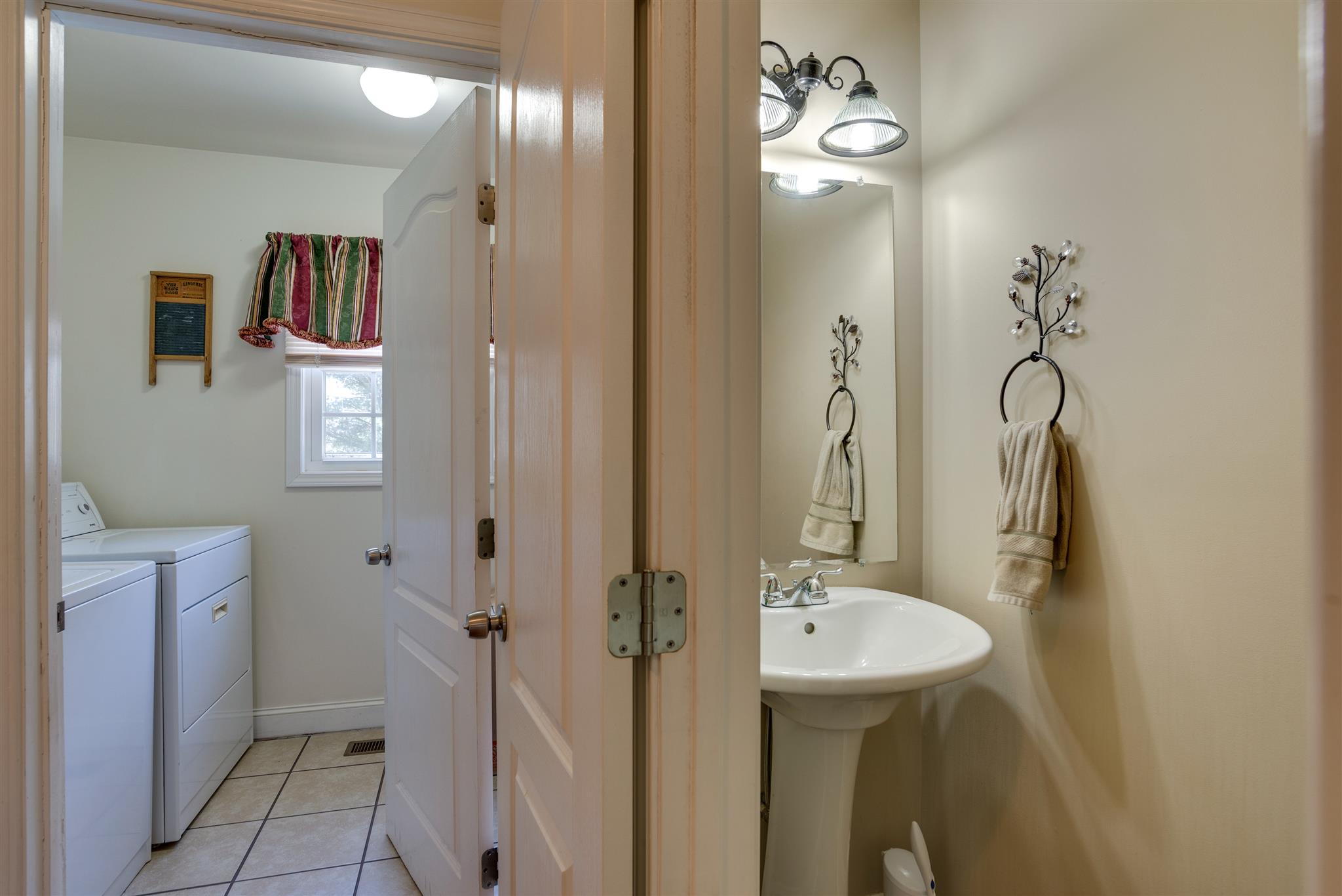 2225 Clara Mathis Road Spring Hill, TN 37174 - Photo 13 of 19 a bathroom with a sink a toilet and shower