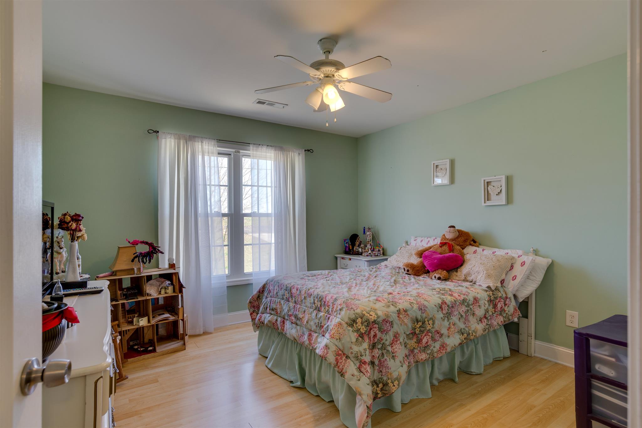 2225 Clara Mathis Road Spring Hill, TN 37174 - Photo 15 of 19 a bed room with a bed and a chandelier