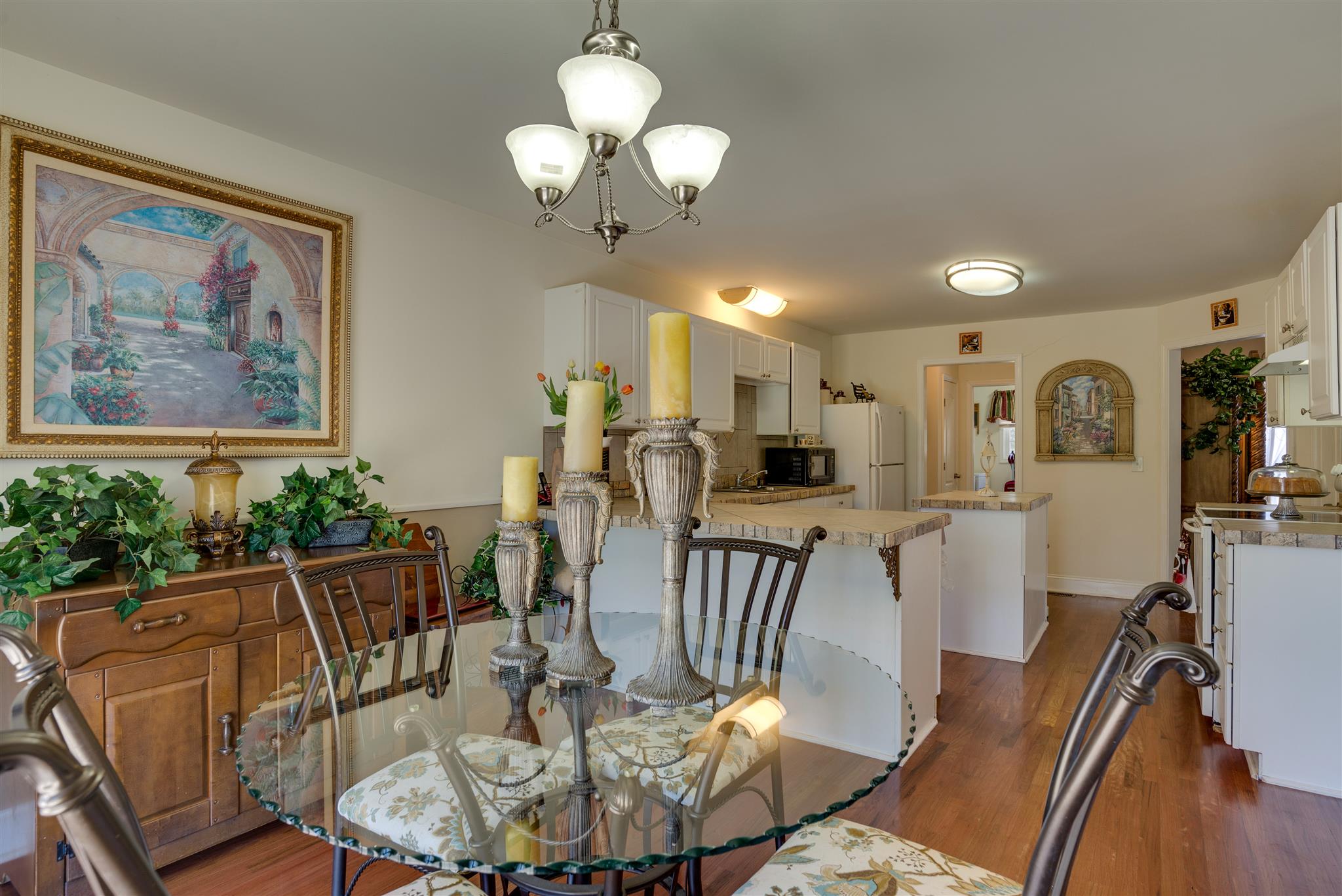 2225 Clara Mathis Road Spring Hill, TN 37174 - Photo 6 of 19 a view of a dining room with furniture a chandelier and wooden floor