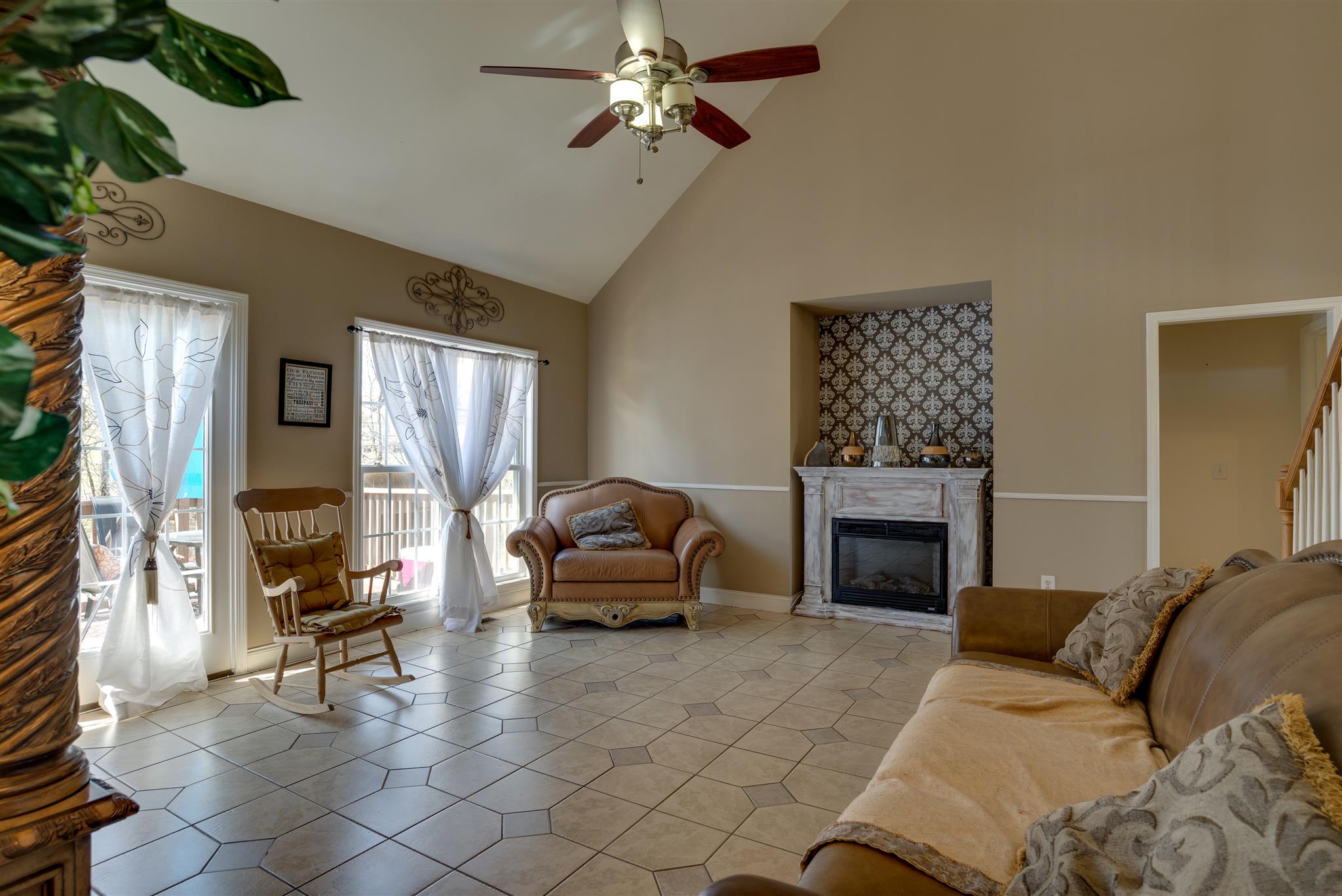 2225 Clara Mathis Road Spring Hill, TN 37174 - Photo 9 of 19 a living room with furniture a fireplace and a table