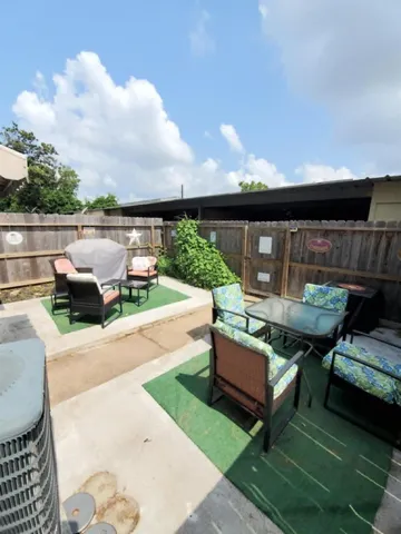 swimming pool view with a seating space