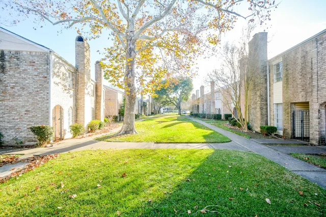 a view of swimming pool with outdoor seating and yard