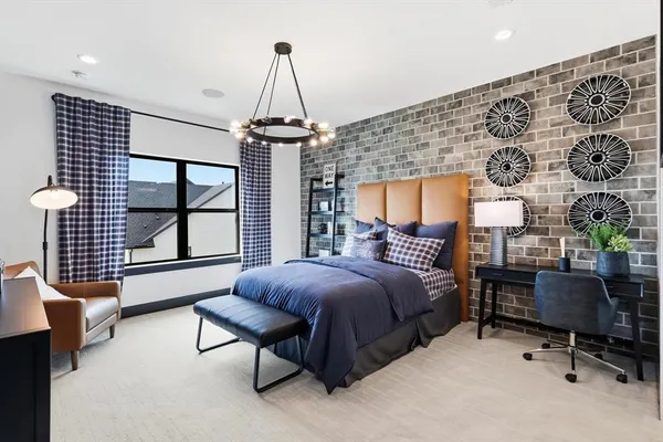 a spacious bedroom with a bed and a window