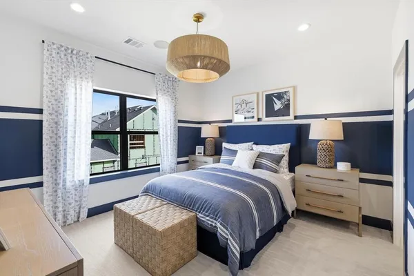 a spacious bedroom with a bed and window