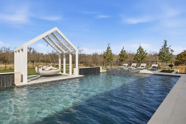 a view of a swimming pool and an outdoor space