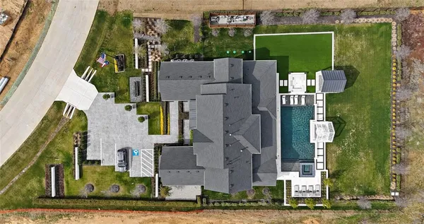an aerial view of a house with a garden