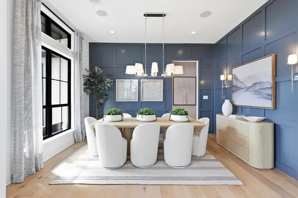 a living room with furniture a large window and kitchen view