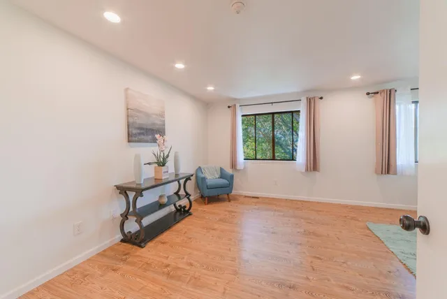 a spacious bedroom with a bed and a couch