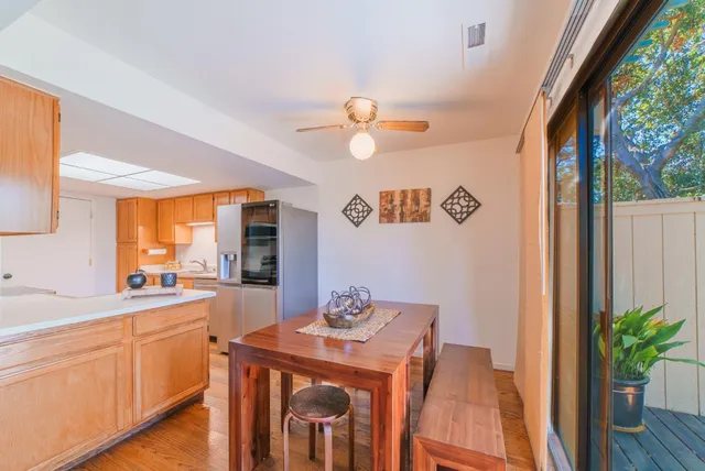 a view of a dining room with furniture window and wooden floor