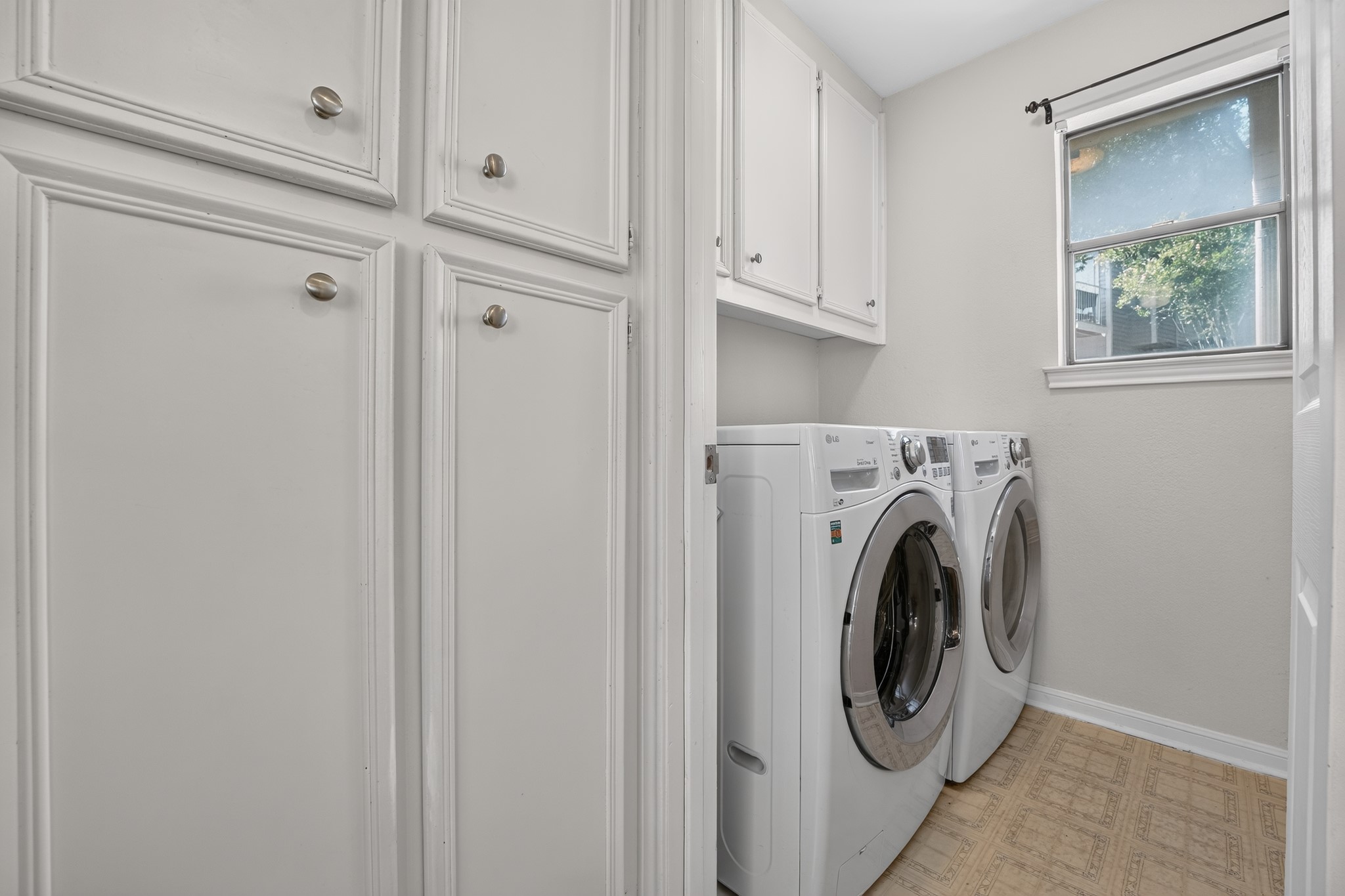 3845 Ranch Road 2222, Unit 32 Austin, TX 78731 - Photo 18 of 24 Laundry room off the kitchen with washer and dryer
