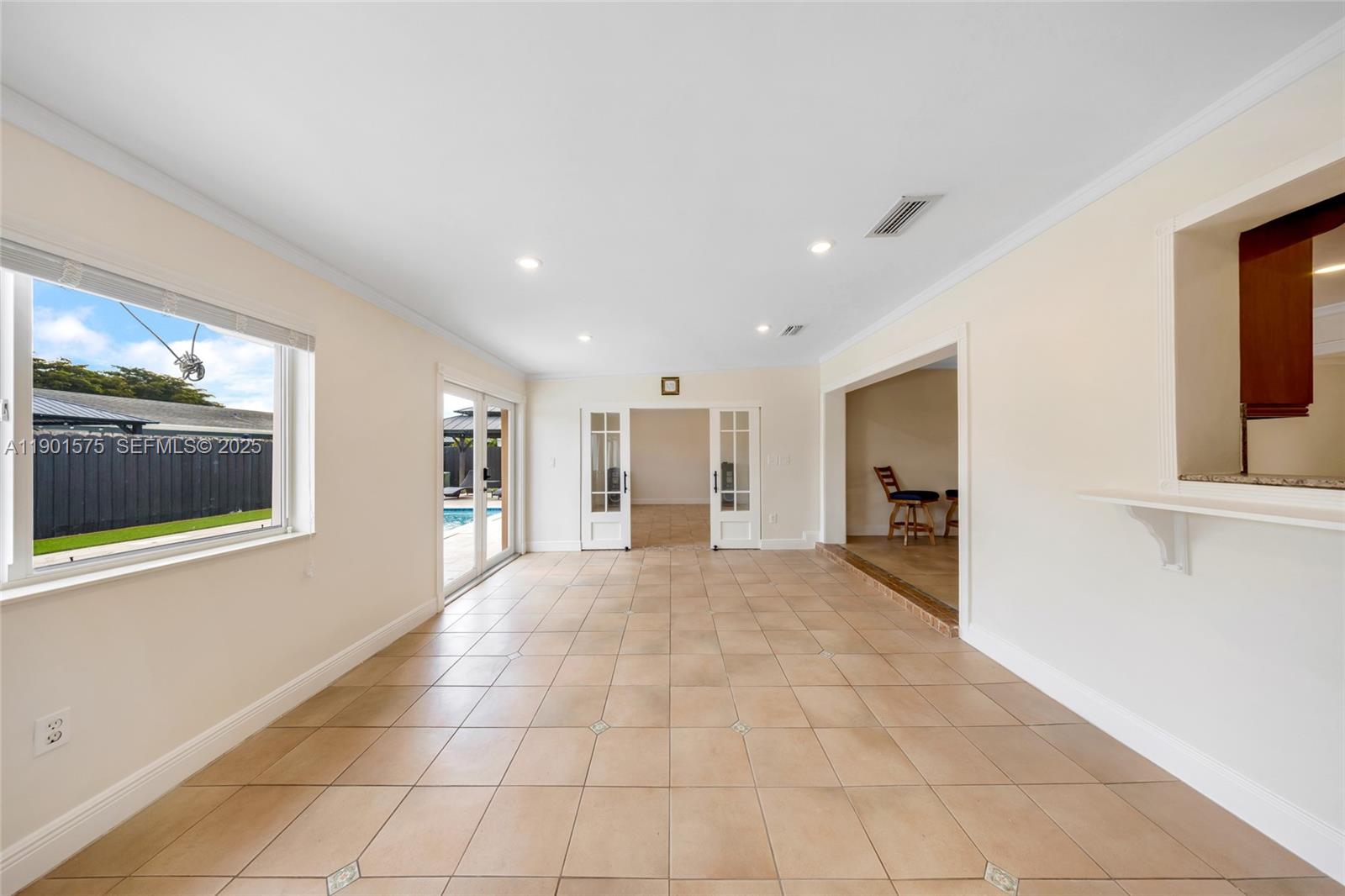 10501 Southwest 126th Avenue Miami, FL 33186 - Photo 16 of 42 a view of an empty room with kitchen and window