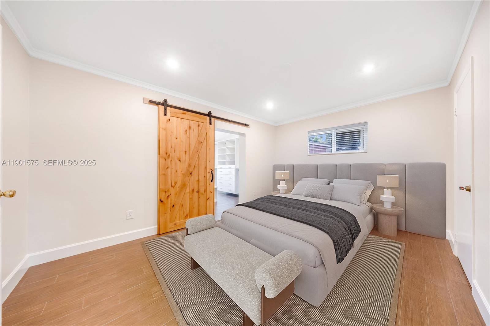 10501 Southwest 126th Avenue Miami, FL 33186 - Photo 18 of 42 a bedroom with a bed and a painting on the wall