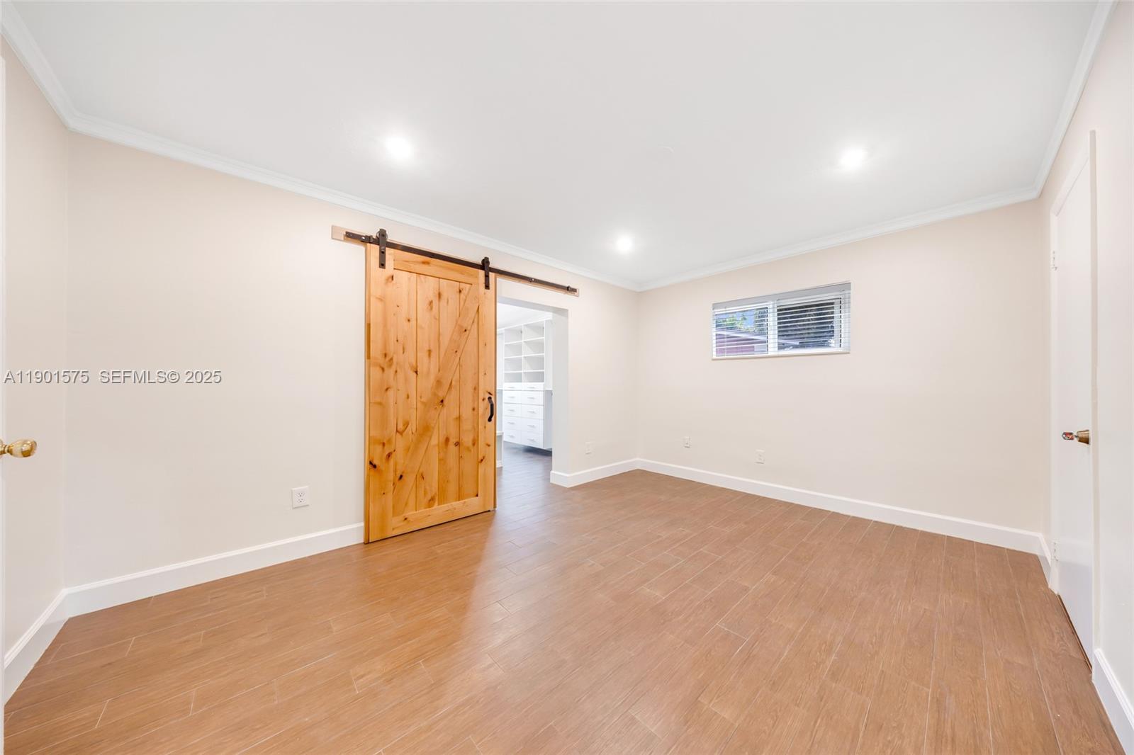 10501 Southwest 126th Avenue Miami, FL 33186 - Photo 19 of 42 a view of an empty room with a window