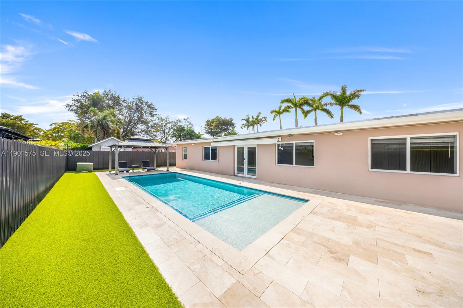 10501 Southwest 126th Avenue Miami, FL 33186 - Photo 2 of 42 a front view of a house with a yard
