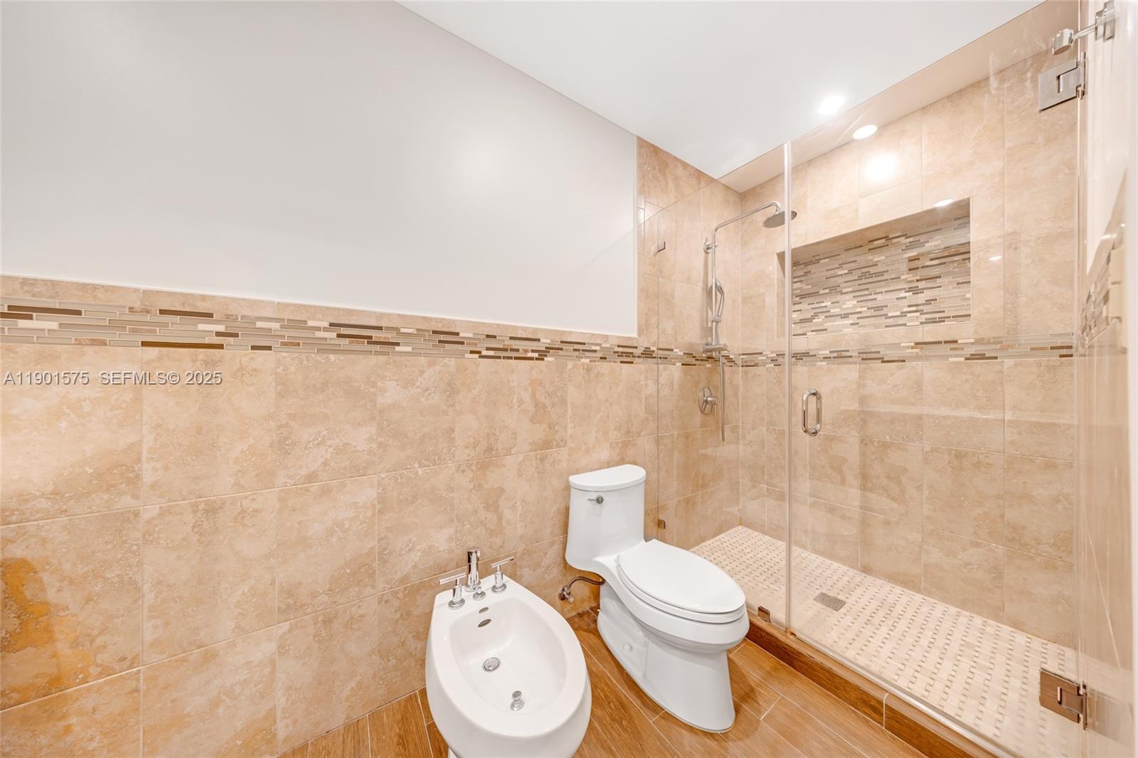 10501 Southwest 126th Avenue Miami, FL 33186 - Photo 22 of 42 a bathroom with a toilet and a shower